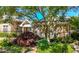 Exterior view showcases a stone clubhouse nestled among mature trees and landscaping, adding to its charm at 3883 Wakefield Hall Se Sq, Smyrna, GA 30080