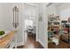 Hallway view leading to a dining area and pantry with ample storage at 3883 Wakefield Hall Se Sq, Smyrna, GA 30080
