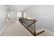 Upstairs hallway with carpet flooring and detailed railing at 3883 Wakefield Hall Se Sq, Smyrna, GA 30080