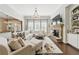 Inviting living room features a fireplace, built-in shelves, and a large sectional, offering a comfortable space at 3883 Wakefield Hall Se Sq, Smyrna, GA 30080