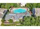 Aerial view of a community pool area, showcasing the pool, pergola, lounge seating, and well-maintained landscaping at 3883 Wakefield Hall Se Sq, Smyrna, GA 30080