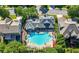 Aerial photograph highlights the pool's flower shape, framed by lush greenery and houses of the neighborhood at 3883 Wakefield Hall Se Sq, Smyrna, GA 30080