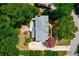 Aerial view of the property, showing the house, driveway, and surrounding greenery at 4047 Jordan Lake Dr, Marietta, GA 30062