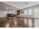 Spacious finished basement with wood floors, a brick fireplace, and lots of natural light at 4047 Jordan Lake Dr, Marietta, GA 30062