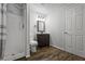 Bathroom featuring a shower, toilet, vanity, and wood-look flooring at 4047 Jordan Lake Dr, Marietta, GA 30062