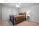 Bedroom with carpet, standard ceiling, and simple decor, plus an iron bed frame and standard closet at 4047 Jordan Lake Dr, Marietta, GA 30062