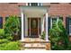 Inviting front entrance featuring a decorative wood door with glass inset and brick exterior at 4047 Jordan Lake Dr, Marietta, GA 30062