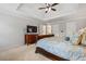 Beautiful main bedroom has carpet, and a trey ceiling with fan, plus multiple windows for ample light at 4047 Jordan Lake Dr, Marietta, GA 30062
