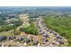 Aerial view of homes showcasing the community layout, landscaping, and golf course at 413 Horizon Trl, Canton, GA 30114