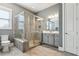 Bathroom with corner glass shower, gray tile, and modern toilet, perfect for relaxation at 413 Horizon Trl, Canton, GA 30114