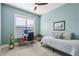 Bedroom featuring a built-in desk, neutral walls, soft carpeting, and a large window at 413 Horizon Trl, Canton, GA 30114