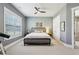 Bedroom with a window and ceiling fan, offering a peaceful retreat for rest and relaxation at 413 Horizon Trl, Canton, GA 30114