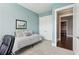 Cozy bedroom features a twin bed, closet, and an open doorway to a spacious hallway at 413 Horizon Trl, Canton, GA 30114