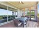 Relaxing covered deck with ample dining space and access to the screened porch via a doorway at 413 Horizon Trl, Canton, GA 30114