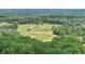 Scenic aerial view of the golf course surrounded by lush forests at 413 Horizon Trl, Canton, GA 30114
