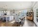 Modern kitchen featuring a large island, stainless steel appliances, and an adjacent dining area at 413 Horizon Trl, Canton, GA 30114