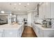 Contemporary kitchen featuring gray cabinets, a large island, stainless appliances and hardwood floors at 413 Horizon Trl, Canton, GA 30114