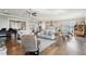 Open-concept living area connecting the kitchen, dining area, and features a grand piano at 413 Horizon Trl, Canton, GA 30114