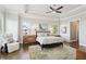 Bright main bedroom with natural light, ceiling fan, and comfortable furnishings at 413 Horizon Trl, Canton, GA 30114