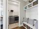 Hallway with coat rack, built-in storage, and a laundry room with new front-load washer and dryer at 413 Horizon Trl, Canton, GA 30114