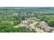 Aerial view of a beautiful neighborhood surrounded by a golf course and lush trees at 413 Horizon Trl, Canton, GA 30114
