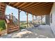 Outdoor seating area located beneath the covered deck, perfect for enjoying the outdoors at 413 Horizon Trl, Canton, GA 30114