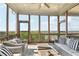Inviting screened porch with wicker seating, a ceiling fan, and scenic views of the horizon at 413 Horizon Trl, Canton, GA 30114