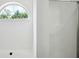 Bright bathroom featuring a soaking tub and a glass door shower at 10423 Commons Xing, Jonesboro, GA 30238