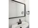 Stylish bathroom with a modern sink, black faucet and a large mirror at 10423 Commons Xing, Jonesboro, GA 30238