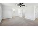 Bright bedroom with neutral carpet, natural light, a ceiling fan, and white walls at 10423 Commons Xing, Jonesboro, GA 30238