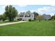 Spacious two-story home featuring lush green lawns and a well-maintained exterior at 10423 Commons Xing, Jonesboro, GA 30238