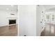 Inviting entryway leading to a living room with hardwood floors and fireplace at 10423 Commons Xing, Jonesboro, GA 30238