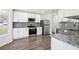 Modern kitchen with stainless steel appliances, granite countertops and white cabinetry at 10423 Commons Xing, Jonesboro, GA 30238