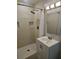 Bathroom featuring modern vanity with updated fixtures and a tiled walk-in shower at 1513 Wildwood Dr, Acworth, GA 30102