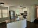 Modern kitchen featuring white cabinets, granite countertops, and stainless steel appliances at 1513 Wildwood Dr, Acworth, GA 30102