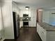 Modern kitchen featuring white cabinets, granite countertops, and stainless steel appliances at 1513 Wildwood Dr, Acworth, GA 30102
