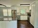 Modern kitchen featuring white cabinets, granite countertops, and stainless steel appliances at 1513 Wildwood Dr, Acworth, GA 30102