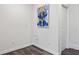Unfinished basement space with wood floors, white walls and art at 476 Springer Nw Bnd, Marietta, GA 30060