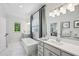 Spa-like bathroom featuring a freestanding tub, double vanity, and modern fixtures at 476 Springer Nw Bnd, Marietta, GA 30060