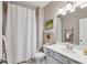 Cozy bathroom with a white shower curtain and decorative shelf, offering a clean and comfortable space at 476 Springer Nw Bnd, Marietta, GA 30060
