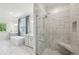 Bright bathroom with a sleek glass shower, featuring marble tile and modern fixtures at 476 Springer Nw Bnd, Marietta, GA 30060