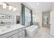 Bright bathroom with a modern soaker tub, double vanity, and elegant fixtures, offering a serene retreat at 476 Springer Nw Bnd, Marietta, GA 30060