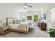 Serene bedroom with a king-sized bed, natural light, and a view into an ensuite bathroom at 476 Springer Nw Bnd, Marietta, GA 30060