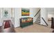 Inviting foyer with dark hardwood floors and decorative artwork, featuring an entryway bench and staircase at 476 Springer Nw Bnd, Marietta, GA 30060