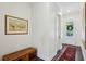 Inviting hallway with hardwood floors, a decorative rug, and natural light from the front door at 476 Springer Nw Bnd, Marietta, GA 30060