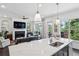 Open concept kitchen and living room featuring white countertops, a fireplace, and large windows at 476 Springer Nw Bnd, Marietta, GA 30060