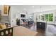 Open concept living space featuring dark hardwood floors, a fireplace, and stairs leading to the upper level at 476 Springer Nw Bnd, Marietta, GA 30060