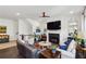 Bright and inviting living room with hardwood floors, a fireplace, and comfortable seating arrangement at 476 Springer Nw Bnd, Marietta, GA 30060