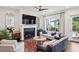 Cozy living room featuring a fireplace, comfortable seating, and a large window with natural light at 476 Springer Nw Bnd, Marietta, GA 30060