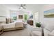 Bright primary bedroom with a luxurious chaise lounge and ensuite bathroom, offering a relaxing retreat at 476 Springer Nw Bnd, Marietta, GA 30060